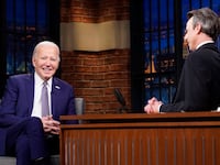 President Joe Biden talks with host Seth Meyers