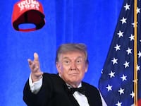 Donald Trump throws his "Trump 2028" hat into an unappreciative audience at this year's 2026 White House Correspondents' Association Dinner.