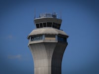 The FAA Air Traffic Control tower at Newark Liberty International Airport in Newark, New Jersey on May 7, 2025. Regulators have been slowing arrivals and departures at one of the United States' busiest airports following a 90-second traffic control system outage last week that has industry experts sounding alarm bells.