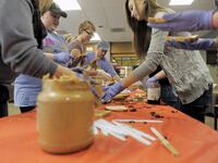 College of Saint Rose students make sandwiches in the PB & Jams event at the college on Tuesday, Oct. 28, 2014, in Albany, N.Y.
