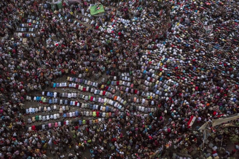 articles/2012/11/01/how-to-build-a-theocratic-democracy/egypt-prayer-openz_ku1veu