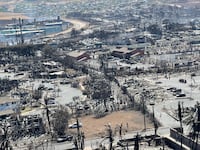 The shells of burned houses and buildings are left after wildfires driven by high winds burned across most of the town in Lahaina, Maui, Hawaii, Aug. 11, 2023.