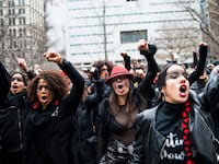 Women protest in front of the court while Harvey Weinstein attends a pretrial session on January 10, 2020 in New York City.