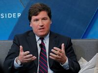 Tucker Carlson speaks at an event
