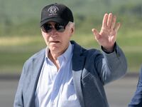 US President Joe Biden waves as he disembarks from Air Force One upon arrival at Henry E. Rohlsen Airport in Christiansted, St. Croix, on the US Virgin Islands, on December 26, 2024, as he arrives for a week-long visit.