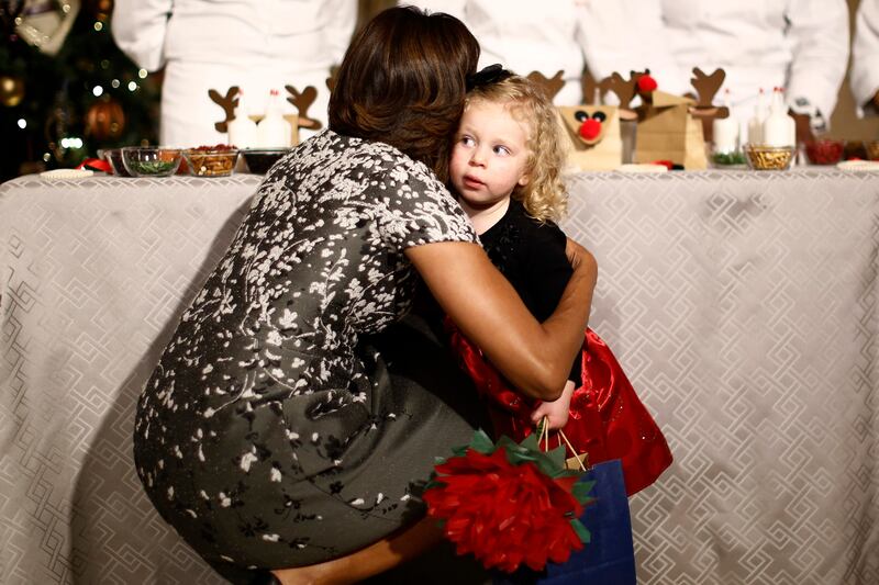 articles/2015/04/28/how-michelle-obama-became-hugger-in-chief/150427-shire-obama2-embed_ku1xpu