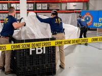 FBI Special Agents assigned to the bureau’s Evidence Response Team processing material recovered from the high-altitude Chinese balloon that was shot down by a U.S. military jet
