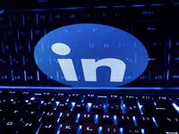 A keyboard is placed in front of a displayed LinkedIn logo in this illustration taken February 21, 2023.