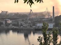 "Smoke rises from the shipyard that was reportedly hit by Ukrainian missile attack in Sevastopol, Crimea, last week
