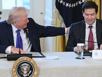 US President Donald Trump speaks with US Secretary of State Marco Rubio (R) during a meeting with US oil companies executives in the East Room of the White House in Washington, DC on January 9, 2026. President Trump is aiming to convince oil executives to support his plans in Venezuela, a country whose energy resources he says he expects to control for years to come. US forces seized Venezuelan president Nicolas Maduro in a sweeping military operation on January 3, with Trump making no secret that control of Venezuela's oil was at the heart of his actions. (Photo by SAUL LOEB / AFP via Getty Images)