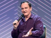 18 May 2022, Hamburg: Director Quentin Tarantino gestures during his appearance. The OMR digital festival in Hamburg focuses on a combination of trade fair, workshops and party. Photo: Jonas Walzberg/dpa (Photo by Jonas Walzberg/picture alliance via Getty Images)