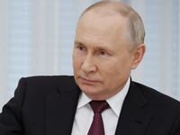 Russian President Vladimir Putin attends a meeting with the crew of the Alyosha T-80 tank, which destroyed a Ukrainian armoured convoy on the Zaporizhzhia direction in the course of Russia-Ukraine conflict, at the Kremlin in Moscow,