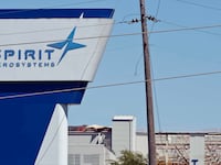The damaged Spirit AeroSystems sign is seen damaged after an EF3 tornado touched ground on April 15, 2012 in Wichita, Kansas