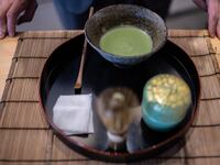 This picture taken on June 6, 2025 shows manager of Jugetsudo tea store Shigehito Nishikida making a bowl of matcha in Tokyo. With its deep grassy aroma, intense colour and pick-me-up effects, the popularity of matcha "has grown just exponentially over the last decade, but much more so in the last two to three years", the 40-year-old explained. (Photo by Philip FONG / AFP) / TO GO WITH: Japan-US-food-drink-lifestyle-internet-agriculture, FOCUS by Caroline Gardin, with Romain Fonsegrives in Los Angeles (Photo by PHILIP FONG/AFP via Getty Images)