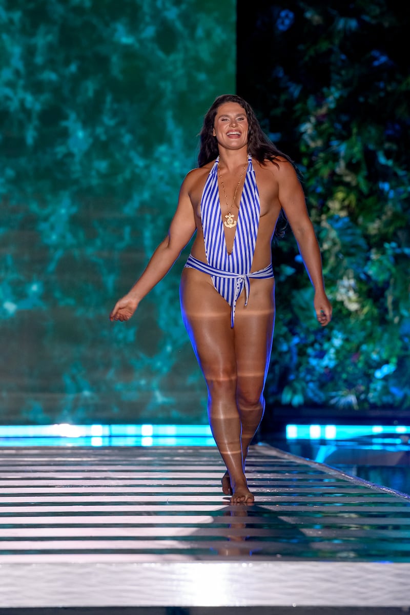 Ilona Maher walked the runway in a striped blue-and-white swimsuit at the Sports Illustrated Swimsuit Runway Show on May 30 in Miami Beach, Florida.