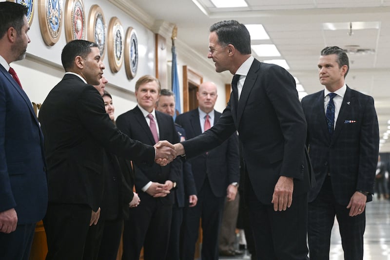 NATO Secretary General Mark Rutte shakes hands with Defense Department senior personnel as US Secretary of Defense Pete Hegseth (R) looks on, at the Pentagon in Washington, DC, April 24, 2025. Rutte is in Washington from April 24 to 25 and has scheduled meetings with Hegseth, US Secretary of State Marco Rubio and National Security Advisor Mike Waltz. (Photo by Brendan SMIALOWSKI / AFP) (Photo by BRENDAN SMIALOWSKI/AFP via Getty Images)