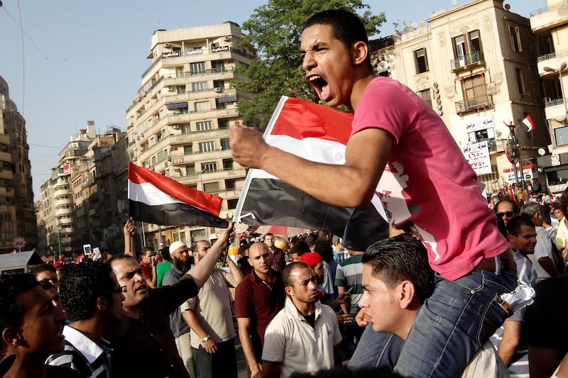 articles/2013/10/15/defeating-the-arab-spring-syndrome-of-self-defeat/tahrir-square-protestor-openz_cqnufg