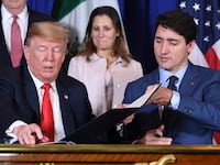 President-elect Donald Trump and Canadian Prime Minister Justin Trudeau sign a new free trade agreement as former Canadian Finance Minister Chrystia Freeland looks on in Buenos Aires, on November 30, 2018.