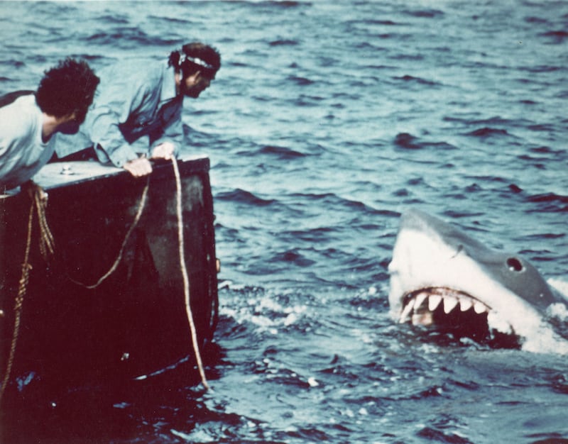 A picture of Richard Dreyfuss, Robert Shaw and 'Bruce' in a scene from the film 'Jaws' directed by Steven Spielberg.