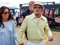 Ines de Ramon and Brad Pitt at the Grand Prix in England.