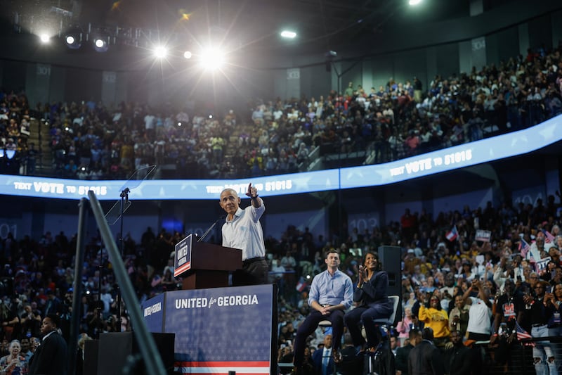 Former US President Barack Obama speaks during a midterm campaign rally while US Senator Jon Ossoff (D-GA) and Democrat gubernatorial candidate Keisha Lance Bottoms look on in Morrow, Georgia, on October 28, 2026. President Barack Obama is joining Jon Ossoff and Keisha Lance Bottoms at the rally.