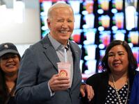 U.S. President Joe Biden poses for photos during a visit to a boba tea shop in Las Vegas, Nevada, U.S., February 5, 2024.