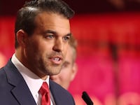 Andrew Kolvet, producer of The Charlie Kirk Show, speaks during the public memorial service for right-wing activist Charlie Kirk