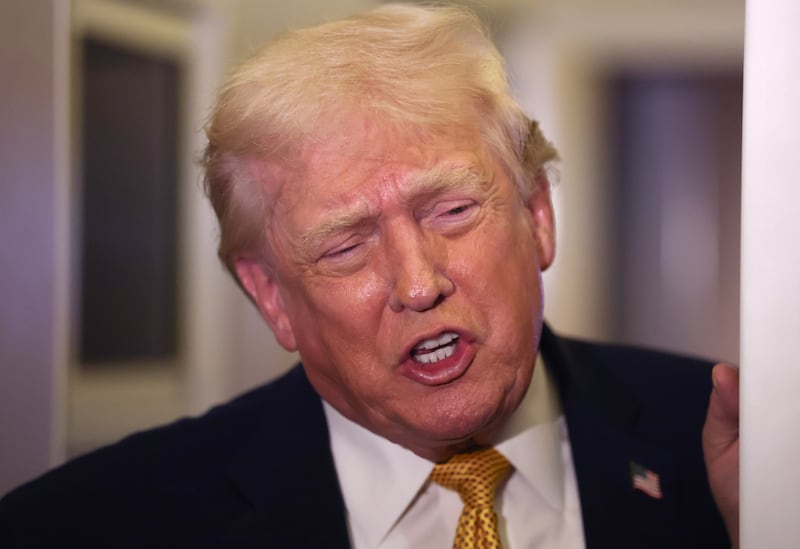President Donald Trump speaks to the media aboard Air Force One en route to Washington, DC on January 04, 2026.