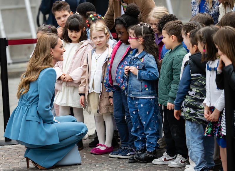 Catherine, Princess of Wales, meets children as she visits the Piazza Camillo Prampolini during the first day of her visit to Reggio Emilia in 2026.