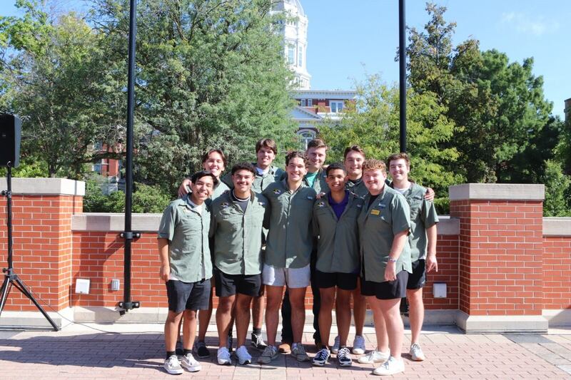 Martinez pictured with a group of fraternity brothers.