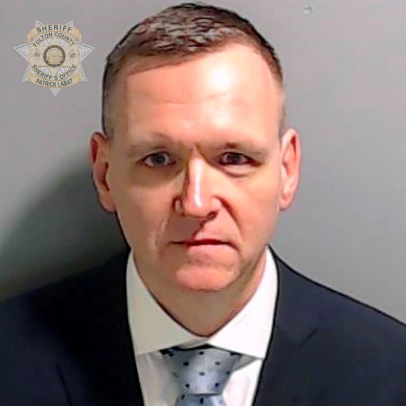 Michael Roman poses for his booking photo at the Fulton County Jail on Aug. 25, 2023 in Atlanta.