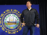 Republican presidential candidate Florida Governor Ron DeSantis listens to a question from the audience at a Never Back Down campaign town hall in Windham, New Hampshire