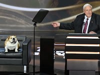West Virginia Gov. Jim Justice and his dog, Babydog, on stage during the Republican National Convention in Milwaukee, Wisconsin in July.