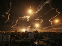 Flares rising up over Gaza Strip.