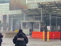 Police officers view the scene after an incident at the Rainbow Bridge U.S. border crossing with Canada, in Niagara Falls.