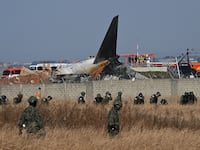 South Korean soldiers search for missing passengers near wreckage of the crashed Jeju Air Boeing 737-800.