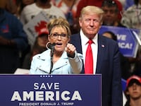 Republican U.S. House candidate former Alaska Gov. Sarah Palin (L) speaks as former U.S. President Donald Trump (R) looks on during a "Save America" rally at Alaska Airlines Center on July 09, 2022 in Anchorage, Alaska. Former President Donald Trump held a "Save America" rally in Anchorage where he campaigned with U.S. House candidate former Alaska Gov. Sarah Palin and U.S. Senate candidate Kelly Tshibaka.