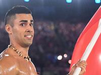 articles/2016/08/06/oily-tonga-flag-bearer-blows-up-twitter/160806-Place-oily-olympics-tonga-man-Tease_hga56i