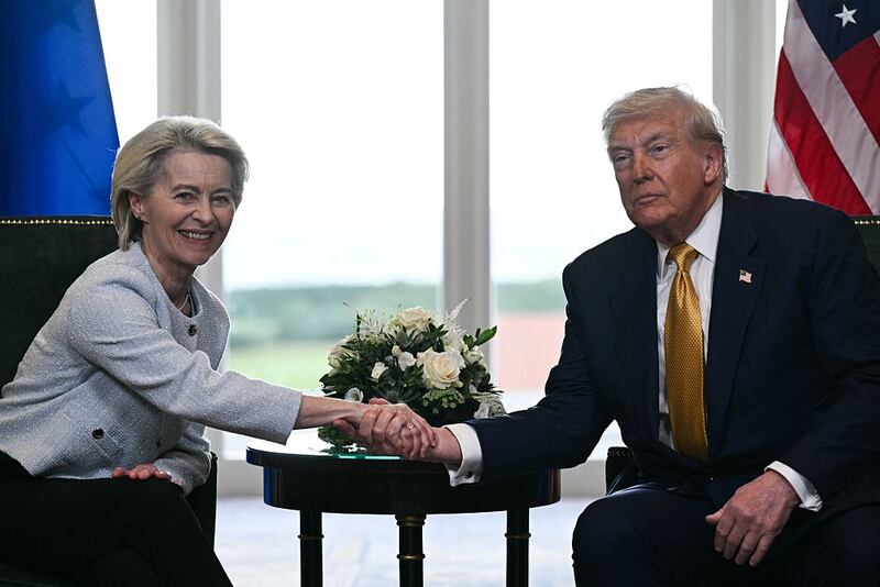 TOPSHOT - US President Donald Trump (R) shakes hands with European Commission President Ursula von der Leyen (L) after agreeing on a trade deal between the two economies following their meeting, in Turnberry south west Scotland on July 27, 2025, on the third day of his visit to the country, since his second tenure as President began. US President Donald Trump said on July 27, 2025 that he had reached a trade agreement with European Union chief Ursula von der Leyen. "We have reached a deal. It's a good deal for everybody," Trump told reporters after talks with von der Leyen at his golf resort in Turnberry, Scotland. The EU chief also hailed it as a "good deal". (Photo by Brendan SMIALOWSKI / AFP) (Photo by BRENDAN SMIALOWSKI/AFP via Getty Images)