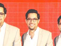 Photo illustration of TJ Ducklo on a red grid background.