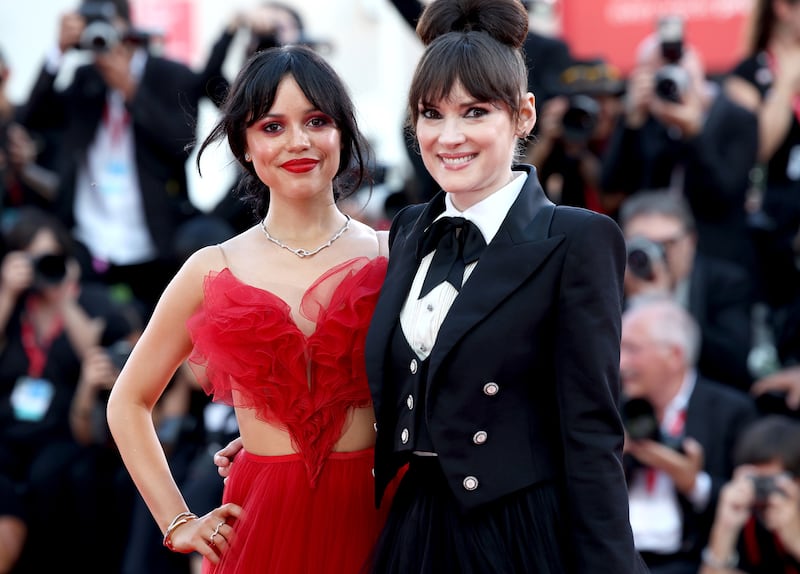 Jenna Ortega and Winona Ryder pose on the red carpet during the Venice Film Festival at on August 28, 2024.