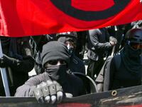 Antifa members and counter protesters gather during a rightwing No-To-Marxism rally on August 27, 2017 at Martin Luther King Jr. Park in Berkeley, California.