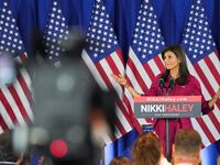 Republican presidential candidate and former U.S. Ambassador to the United Nations Nikki Haley gestures as she speaks to the crowd at a caucus night party in Iowa.