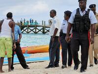 Police officers walk on the beach after what police described as a fatal shark attack against a tourist at Sandals Royal Bahamian resort, in Nassau, Bahamas December 4, 2023.