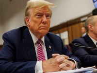 Former U.S. President Donald Trump sits at the defendant's table during his criminal trial