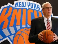 Phil Jackson poses during a news conference announcing him as the team president of the New York Knicks basketball team at Madison Square Gardens in New York March 18, 2014.