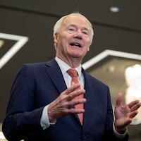 Asa Hutchinson speaks to media following the Republican Party of Iowa legislative breakfast in January 2024.