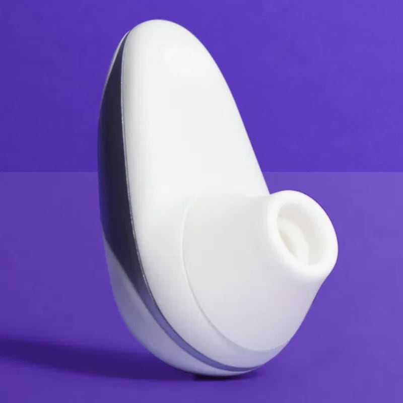 A sex toy on a purple background.