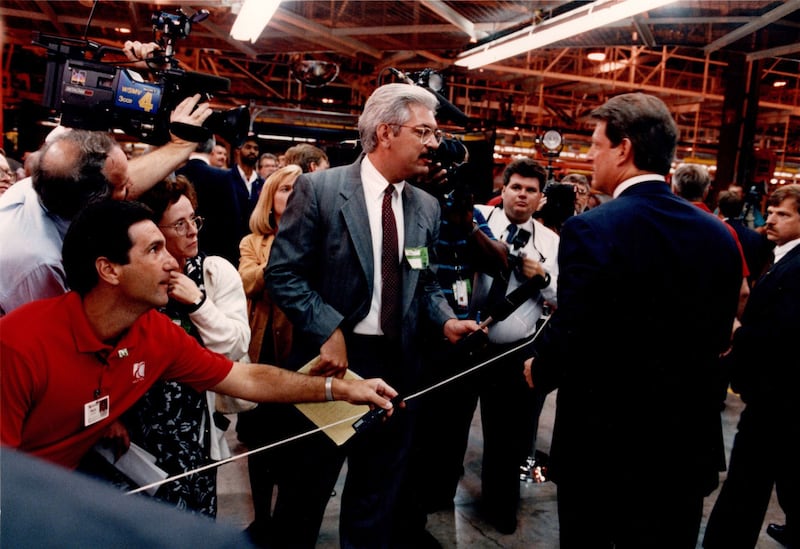 A photograph of Phil Williams questioning Vice President Al Gore during Gore's visit to General Motors' Saturn plant in Teneessee in 1993.