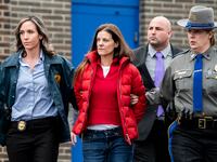 Michelle Troconis is escorted out of the Troop G State Police station before being placed into a cruiser Tuesday afternoon, Jan. 7, 2020.
